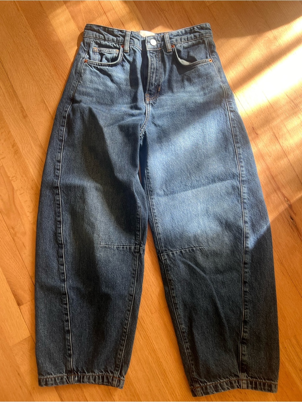 Women’s Reformation (Anthropology) Wide-Leg High-Rise Jeans in Dark Blue Denim.